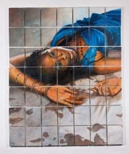 large painting of fashion model lying on the floor