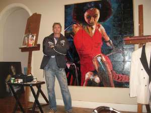 Steve standing in front of a large pallet knife oil painting